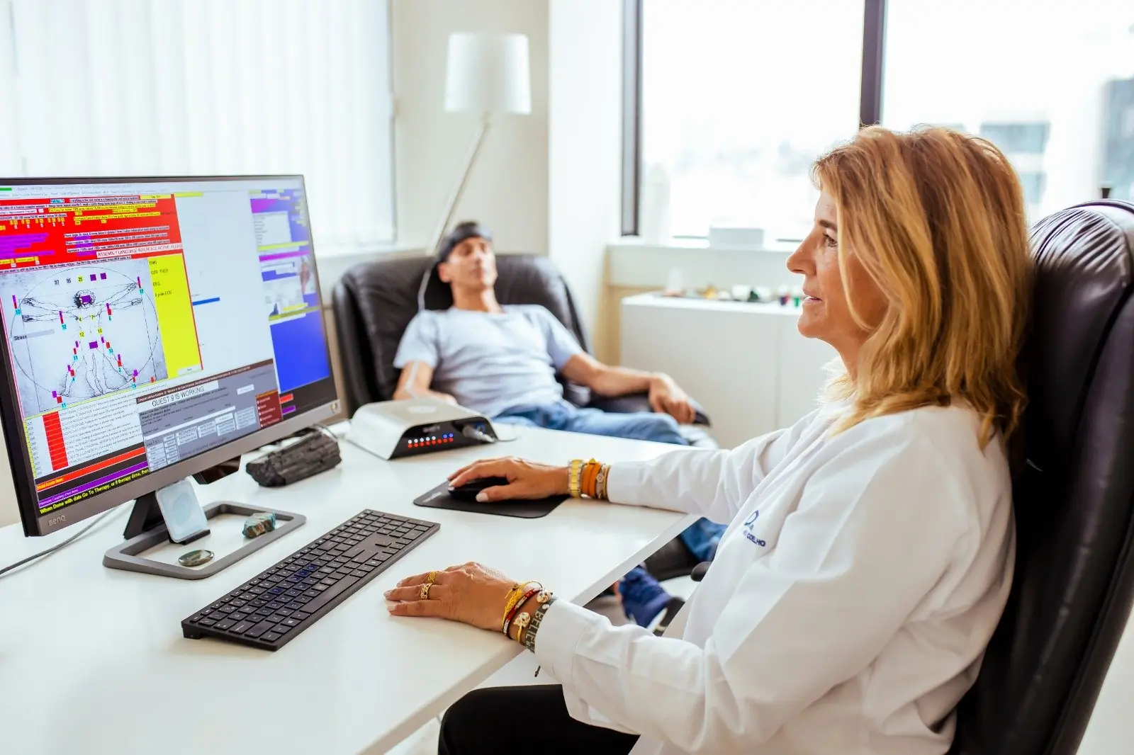 Biofeedback FPC live clinic session with practitioner, client, and equipment visible.
